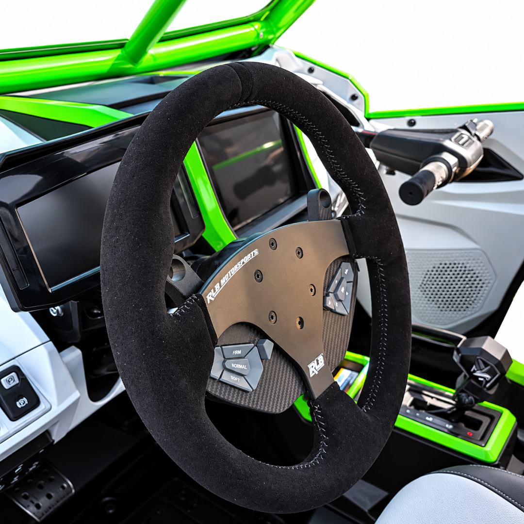 side view of Adapt IQ installed on RLB steering wheel in a Kawasaki KRX H2